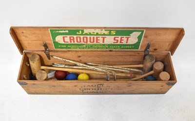 Lot 450 - A Jaques croquet set, in wooden case.