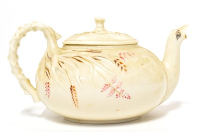 Lot 525 - BELLEEK; a First Period marked teapot of grass...