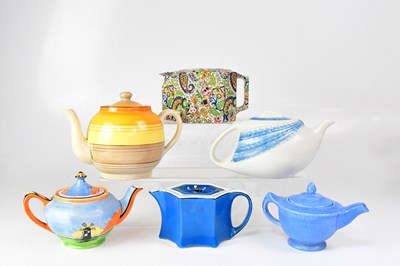 Lot 542 - Six teapots of stylised form, to include an...