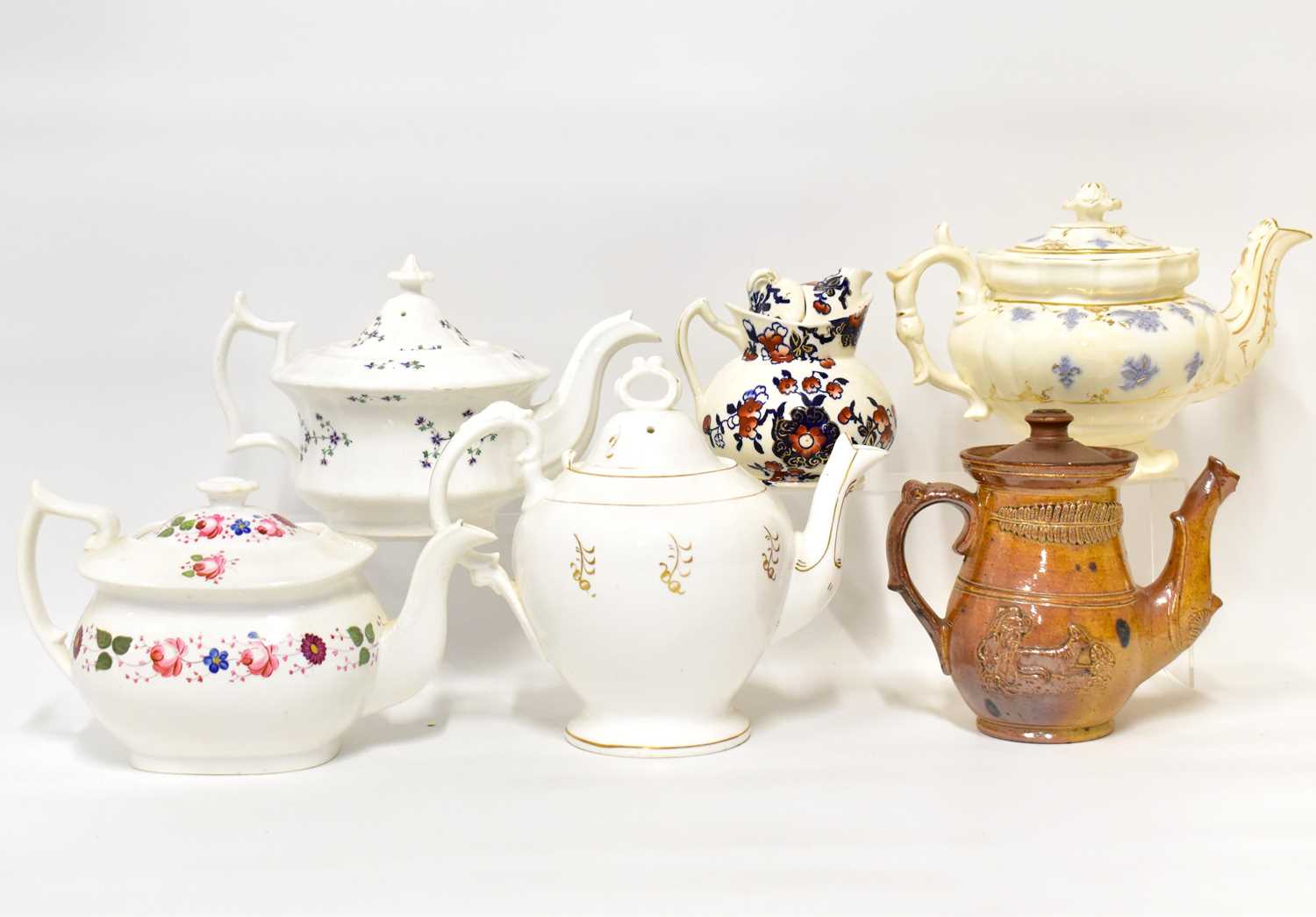 Lot 541 - Six Victorian pottery teapots, to include four...