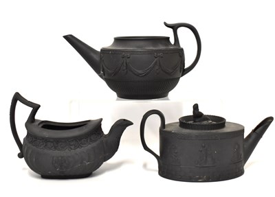 Lot 540 - Three 19th century black basalt teapots, to...