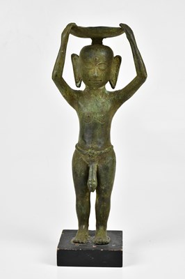 Lot 1187 - An East Asian bronze figure of a nude male,...