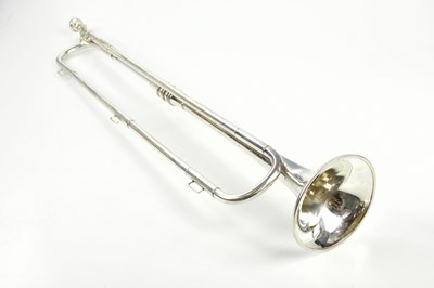 Lot 1311 - PREMIER; a silver plated bugle, 76cm.