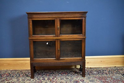 Lot 2393 - An early 20th century oak Chapter Simpoles...
