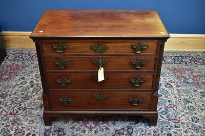 Lot 2448 - A George III mahogany chest of four long...