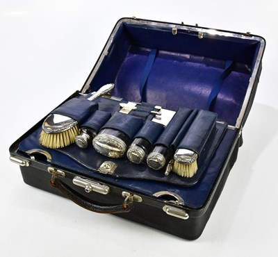 Lot 2325 - An early 20th century leather travelling bag,...
