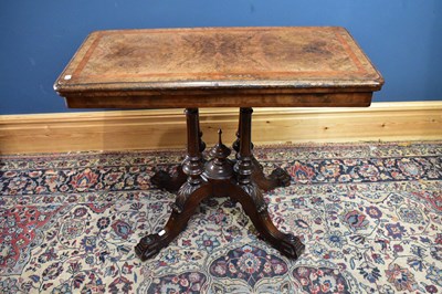 Lot 2586 - A Victorian inlaid walnut fold over swivel-top...