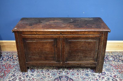 Lot 2371 - An 18th century oak coffer with two panelled...