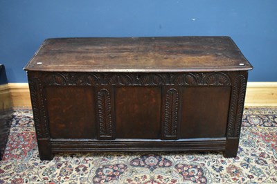 Lot 2374 - An 18th century oak coffer with carved and...