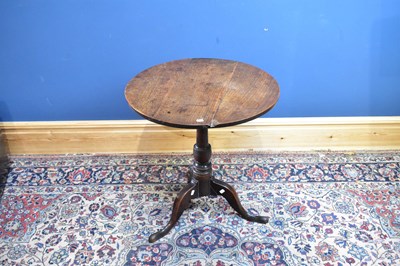 Lot 2395 - A Georgian oak tilt-top tripod table, height...