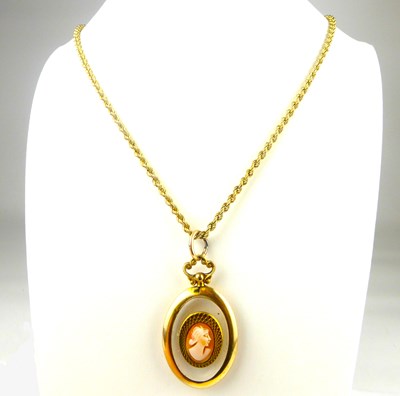 Lot 863 - A clear oval necklace pendant in a 9ct gold...