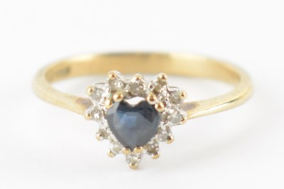 Lot 833 - A 9ct gold ring with central heart-shaped...