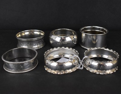 Lot 775 - Seven various hallmarked silver napkin rings,...