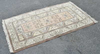 Lot 2290 - An Eastern style rug of geometric decoration,...