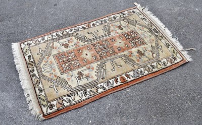 Lot 2291 - An Eastern style rug, 140cm x 88cm.