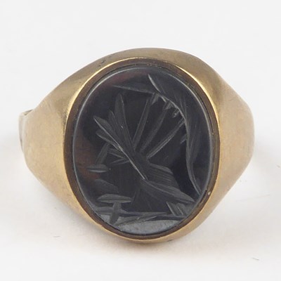 Lot 832 - A 9ct gold intaglio ring, the rub-over inset...