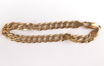Lot 847 - A 9ct gold flat curb bracelet with lobster...