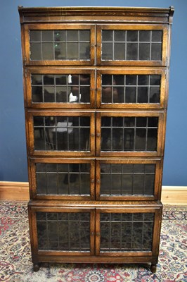Lot 2363 - MINTY; an early 20th century oak five section...
