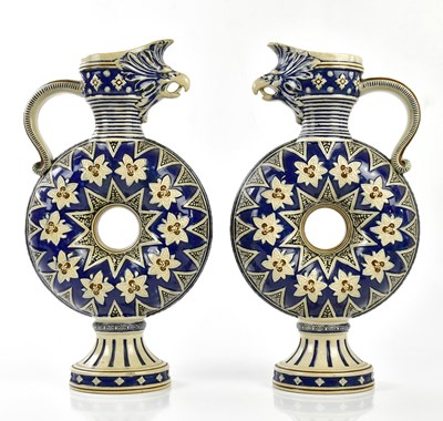 Lot 2062 - MERKELBACK & WICK; a pair of stoneware ewers,...