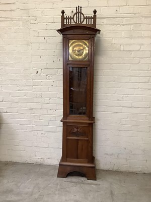 Lot 2342 - An Arts & Crafts oak longcase clock with...
