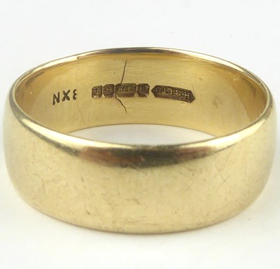 Lot 836 - A 9ct gold wide band ring, size V, approx. 7.3g.