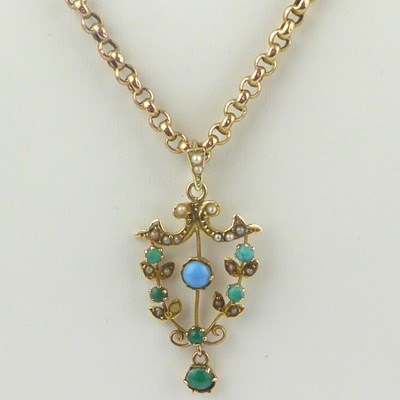 Lot 860 - An Edwardian-style 9ct gold turquoise pendant,...