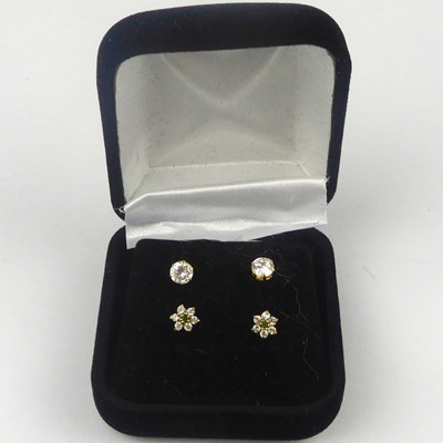 Lot 871 - Two pairs of 9ct gold stud earrings,...