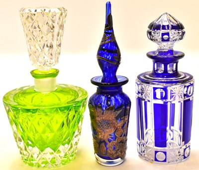 Lot 594 - Three art glass perfume decanters, one with...