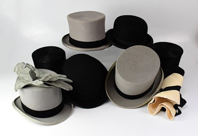 Lot 431 - A collection of hats comprising a black silk...