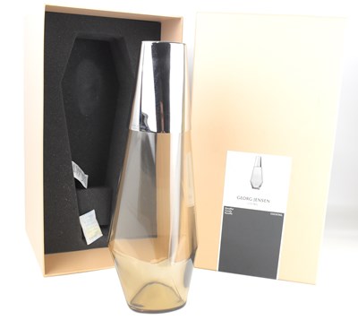 Lot 607 - GEORG JENSEN; a smoked glass and stainless...