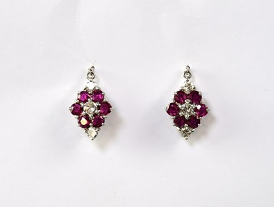 Lot 827 - An 18ct yellow gold ruby and diamond cluster...