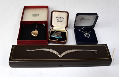 Lot 859 - An 18ct white gold heart-shaped pendant set...