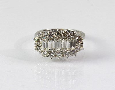 Lot 820 - An 18ct white gold diamond cluster ring, with...