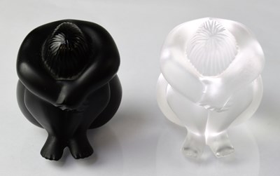 Lot 615 - LALIQUE; a pair of seated figures, titled...