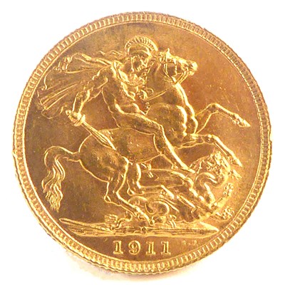 Lot 779 - A George V 1911, sovereign, George and Dragon,...