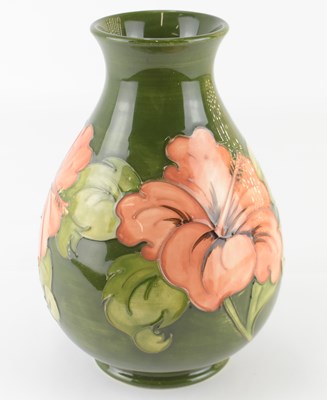 Lot 461 - WALTER MOORCROFT; a 'Hibiscus' pattern tube...