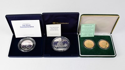 Lot 791 - Three cased presentation coins, comprising a...