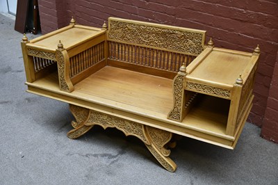 Lot 2623 - A carved softwood Thai style bench, height...