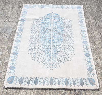 Lot 115 - A hand knotted Persian woollen carpet with...