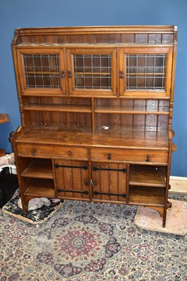 Lot 2384 - An Arts & Crafts oak sideboard, the raised...