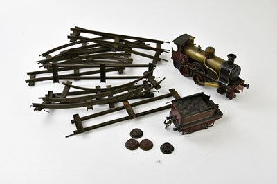 Lot 4342 - A clockwork locomotive with assorted track in...