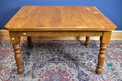 Lot 2569 - A late 19th century oak kitchen table on...