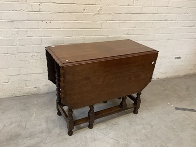 Lot 2504 - Two 1920s oak drop-leaf gateleg dining tables...