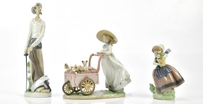 Lot 2181 - LLADRO; three figures to include, "kitty cart",...