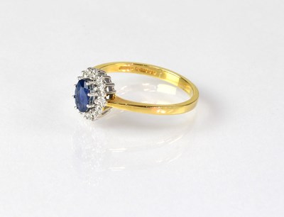 Lot 838 - An 18ct yellow gold cluster ring, with central...
