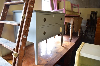 Lot 1020 - A painted chest of two drawers on spade feet,...