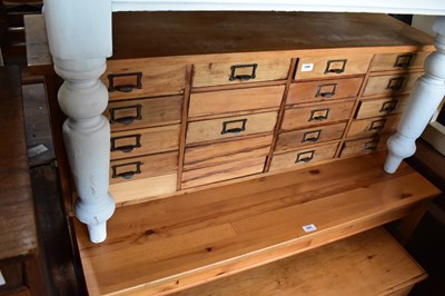 Lot 1090 - A vintage pine haberdashery type chest with an...