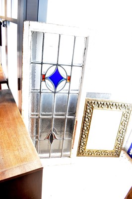 Lot 1113 - Two leaded stained glass panels within painted...