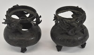 Lot 633 - A pair of Japanese bronze dragon decorated...
