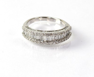 Lot 824 - An 18ct white gold half eternity ring set with...